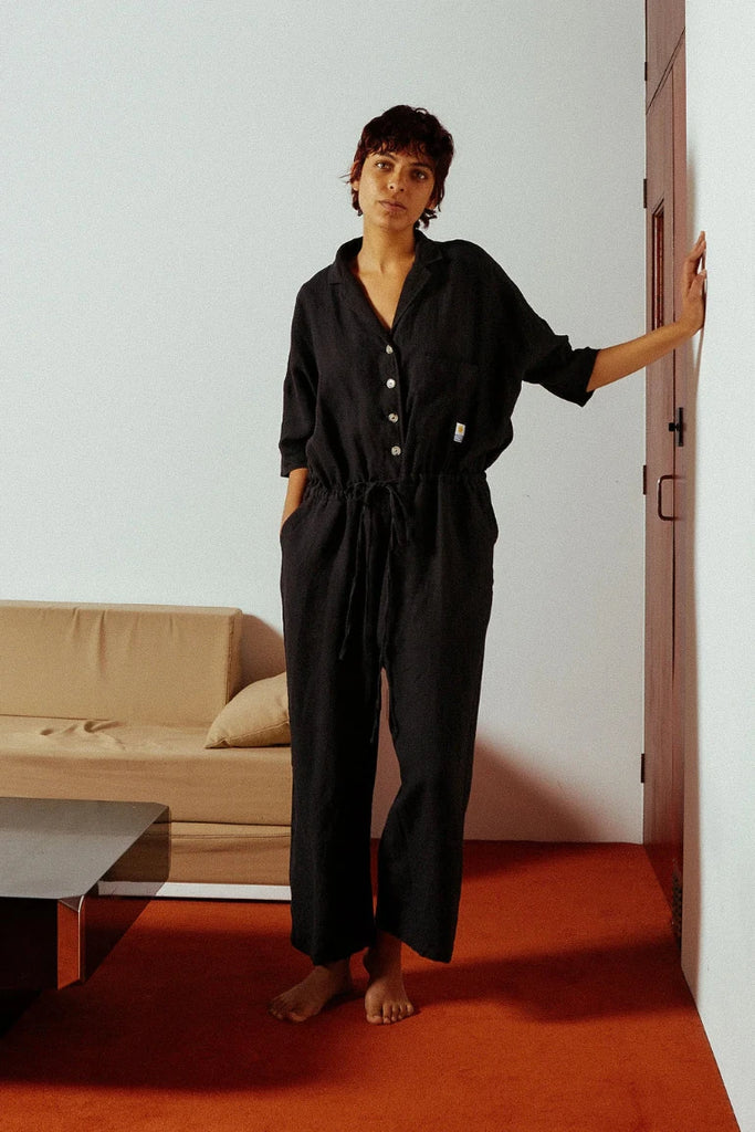 Woman in a LF Markey jumpsuit. 